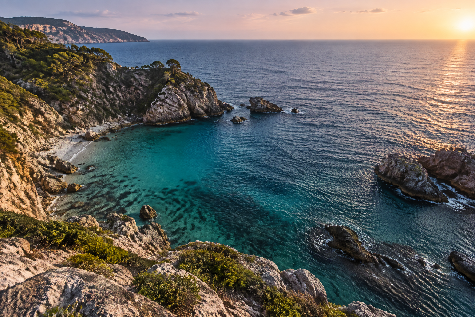 Clear blue cove seen from a clifftop