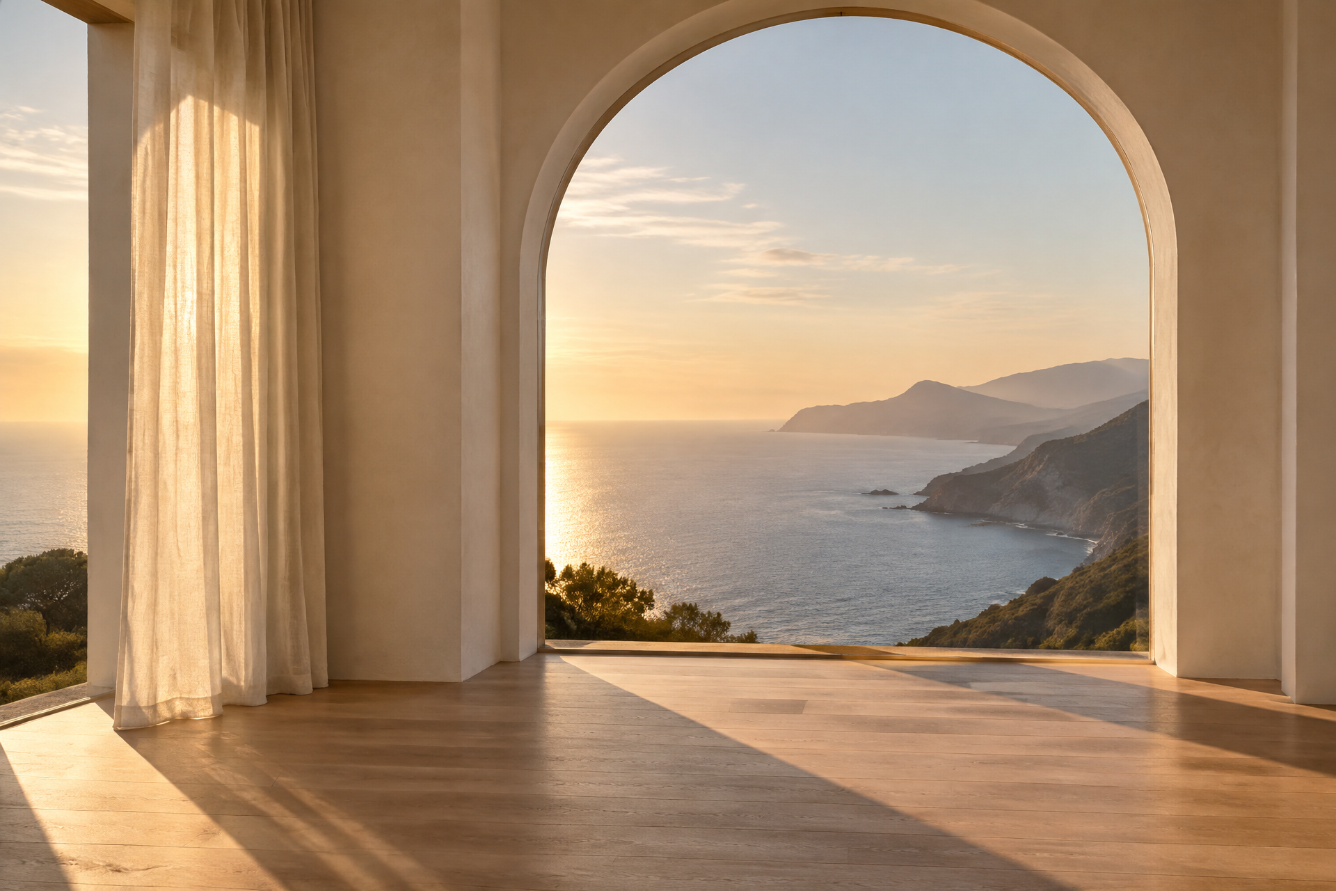 Arched window opening onto the ocean at golden hour
