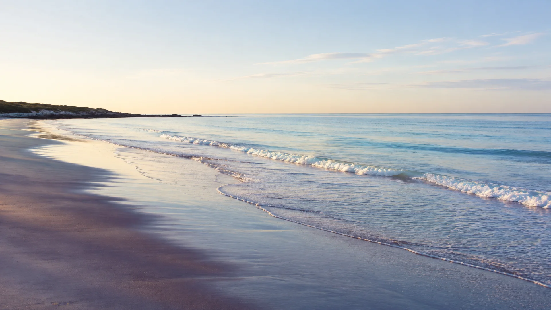 Quiet shoreline in soft morning light